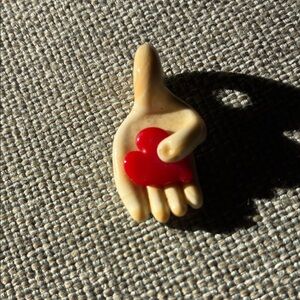 Handmade Beige Hand pendant with Red Heart